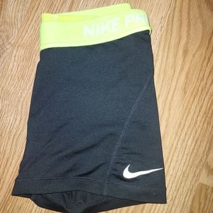 Black and neon yellow nike pros